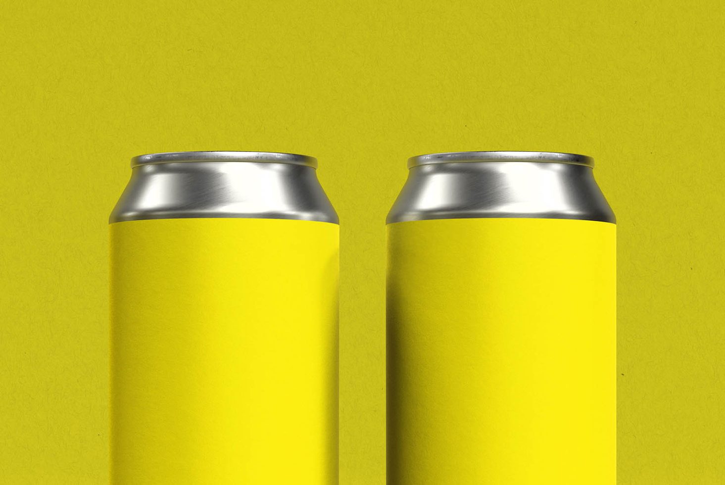 Two blank yellow soda cans on a vibrant yellow background for mockup design showcasing, ideal for branding and packaging presentations.