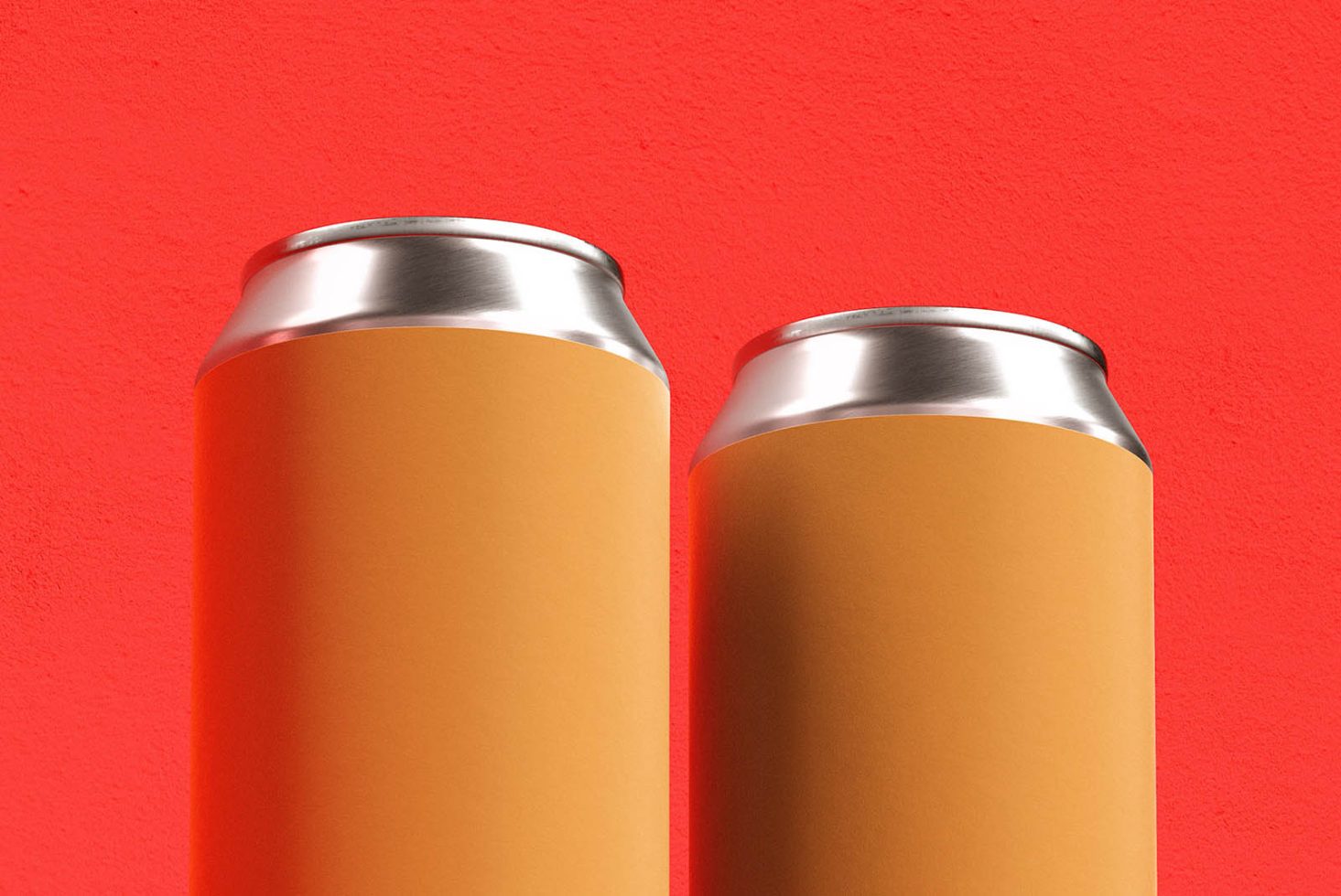 Blank aluminum can mockup on red background, ideal for beverage packaging designs, with space for branding graphics.