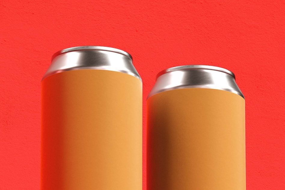 Two tall cans with brushed metal tops, tan label wrap on bright red background