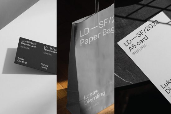 Elegant branding mockup set featuring business cards, paper bag, and A5 card, with a modern black and white design on a wooden surface.