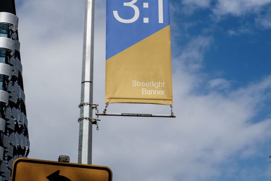 Streetlight banner mockup hanging on a pole with clear sky background, urban outdoor advertising, graphic design template.
