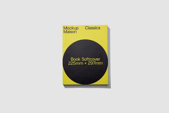 Yellow book softcover mockup with black circle design on cover, dimensions 225mm x 297mm, clear shadow, isolated on grey for designers.