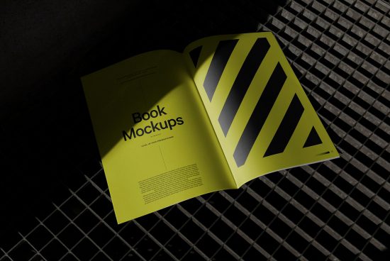 Open book mockup on geometric pattern surface with creative lighting, showcasing design space, suitable for presentations and portfolios.