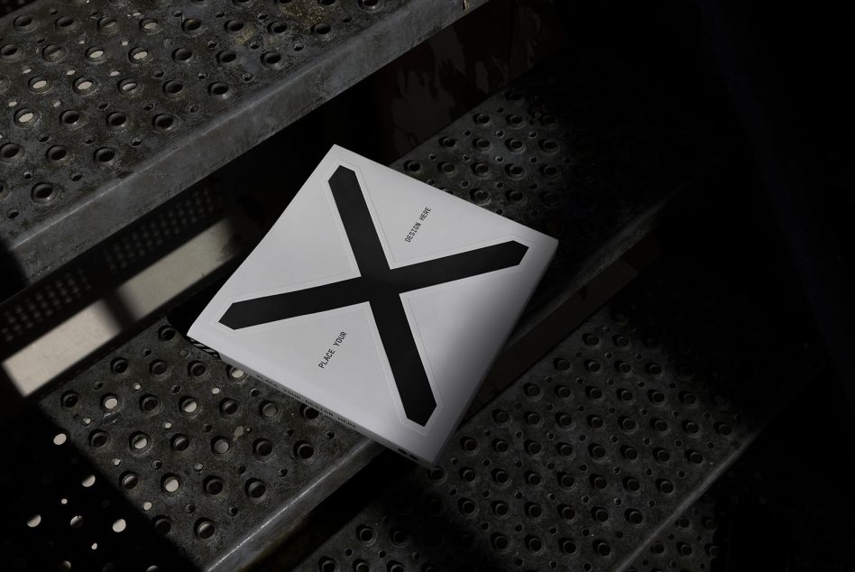 White square packaging mockup with large black cross symbol, minimalist design