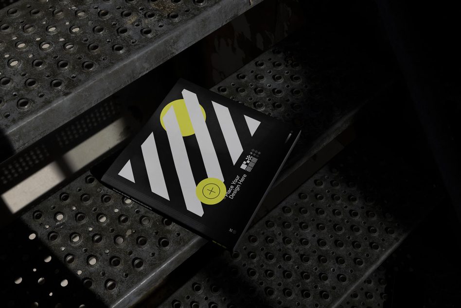 Black envelope mockup with white striped design, yellow circular branding element