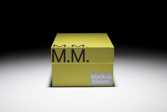 Olive green packaging box mockup with simplistic branding in a studio setting, ideal for product presentation and design showcases.