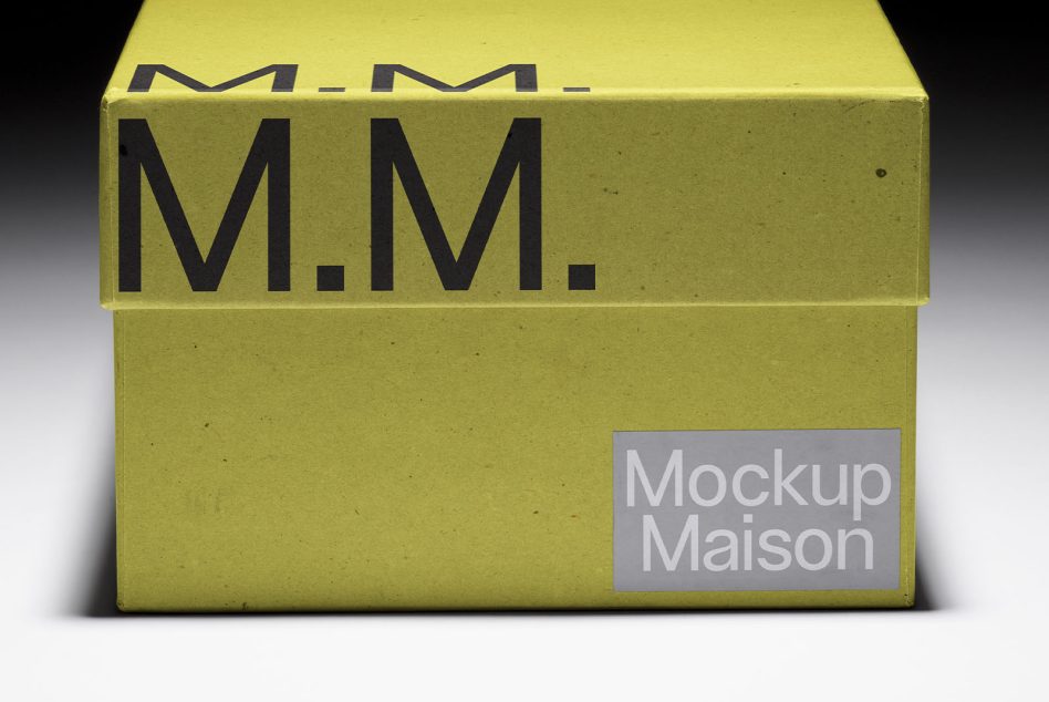 Yellow box shown from above with M.M. text on lid edge, Mockup Maison label below