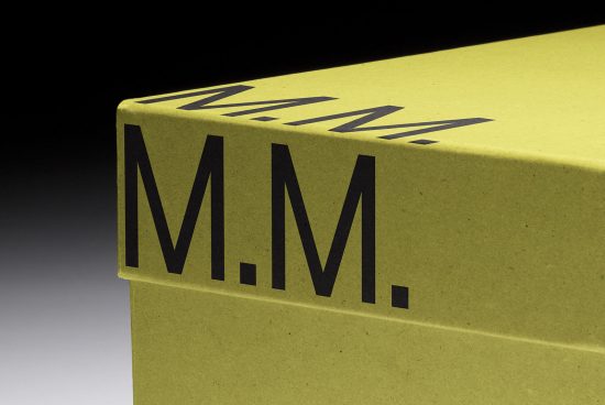 Close-up of yellow package with bold black letters, ideal for font showcase, typography design mockup, graphic design asset.