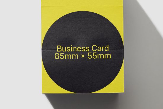 Yellow and black business card mockup with dimensions 85mm x 55mm displayed in a creative layout suitable for graphic designers.