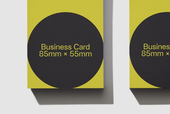 Yellow and black business card mockup showing front design, standard 85mm x 55mm size, clear typography, realistic shadows, design asset.