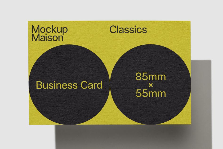 Yellow and black business card mockup design on gray background, showcasing standard dimensions of 85mm x 55mm for graphic designers.