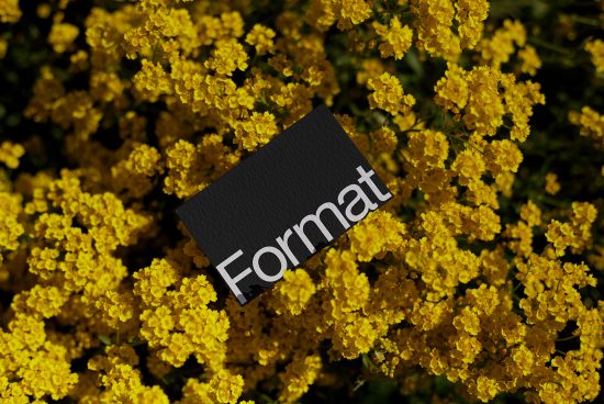Business card mockup on yellow flowers background. Elegant presentation for designers, branding identity, floral mockup template.