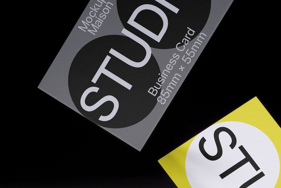 Gray business card at angle with large white circle containing STUDIO text