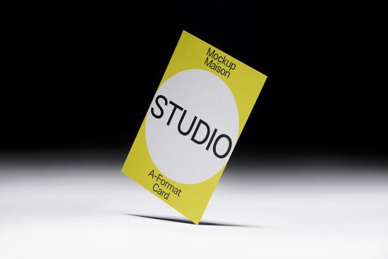 Bright yellow A-format card mockup with white circle design and black text on dark background, ideal for designers portfolio display.