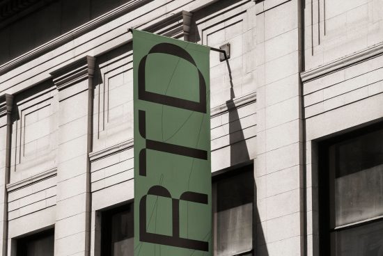 Vertical banner mockup on building facade with green typography design for outdoor advertising, branding, and graphic marketing materials.
