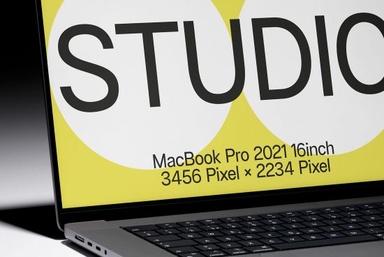 Close-up of MacBook Pro screen with sample design display, ideal for high-resolution device mockups, digital design presentation, creative assets.
