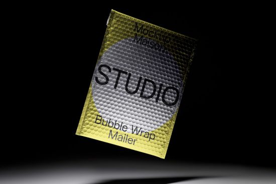 Yellow bubble wrap mailer envelope mockup with branding space on a black background, perfect for designers looking for packaging mockups.