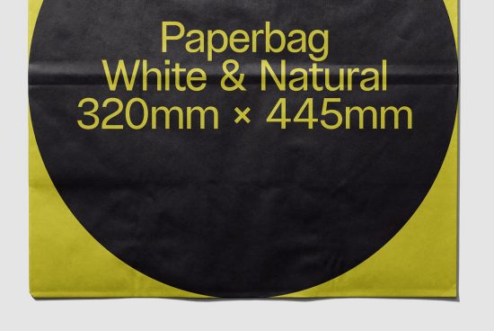 Flat lay of a paper bag mockup with black and yellow design, dimensions 320mm x 445mm for packaging presentations.