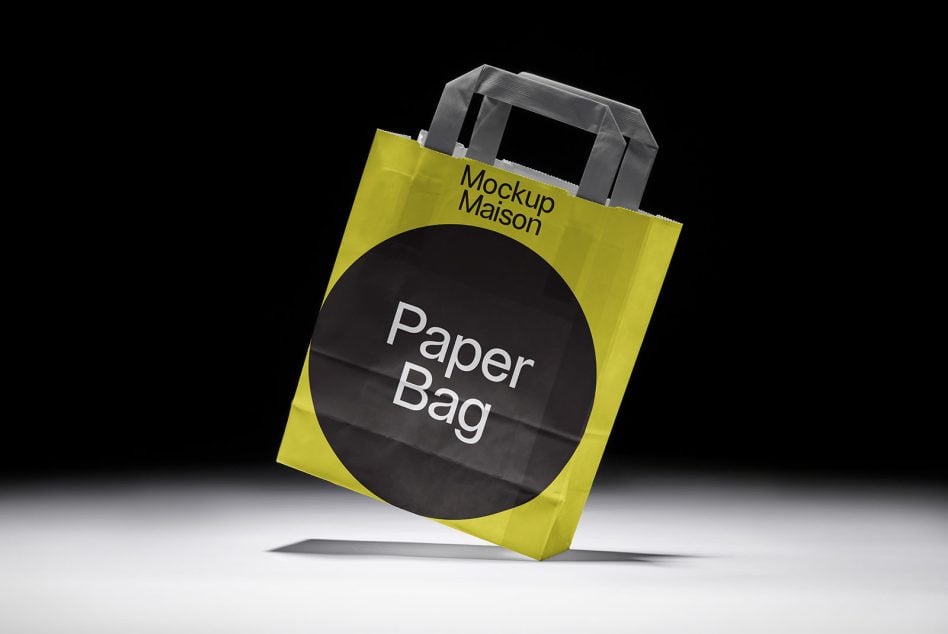 Bright yellow paper bag with gray handles, black circle showing Paper Bag text