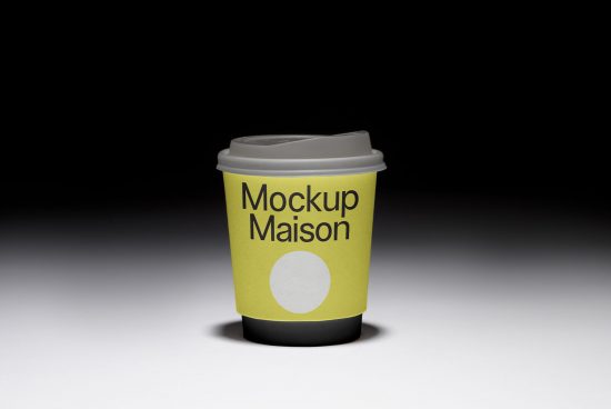 Paper coffee cup mockup on dark background with customizable design, ideal for presentations and branding for designers.