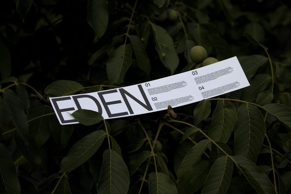 White folded ribbon mockup with EDEN text on natural branch