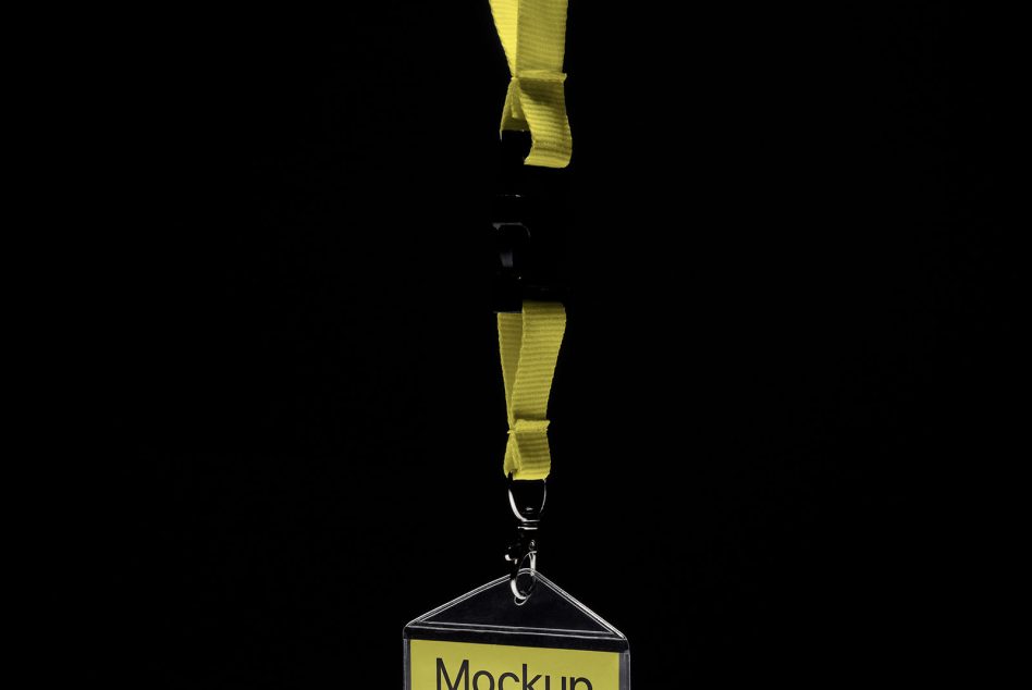 Lanyard badge mockup with yellow strap on black background, realistic design asset for presentations and branding.