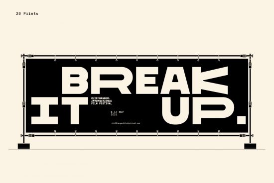 Graphic design mockup of a bold typographic banner reading "BREAK IT UP" for a film festival, displayed on a hanging frame.