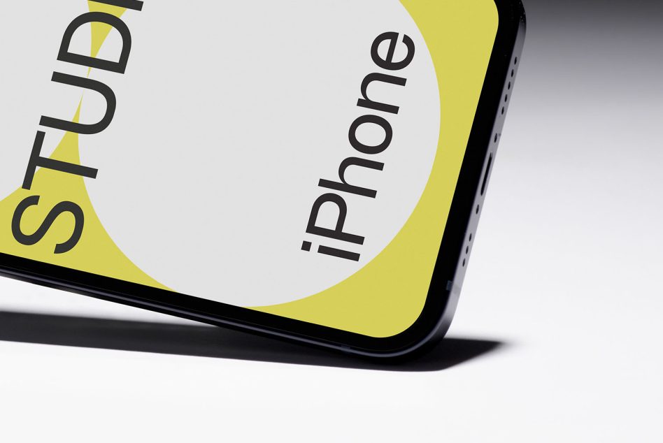 Close-up of iPhone corner showing yellow design with Studio text cutout