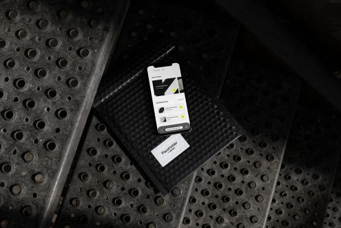 Smartphone on textured surface displaying UI design mockup, modern mobile app screen, ideal for designers creating templates.