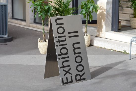 Sleek exhibition room signboard mockup on pavement, modern design, ideal for display in graphics and templates category for designers.