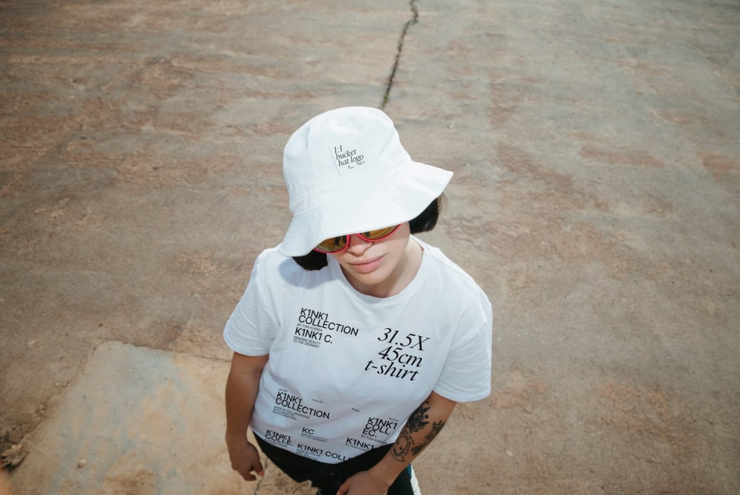 Woman in white bucket hat and t-shirt mockup for fashion design with editable text and logo space, perfect for graphic designers.