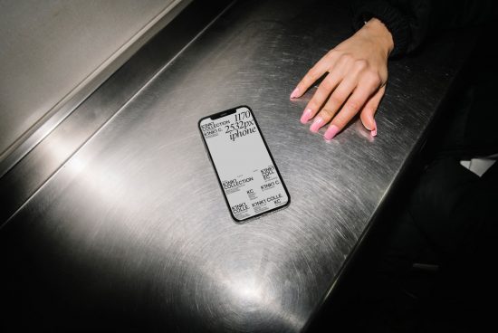 Smartphone mockup on metal surface with woman's hand, displaying screen dimensions, design template for user interface testing.