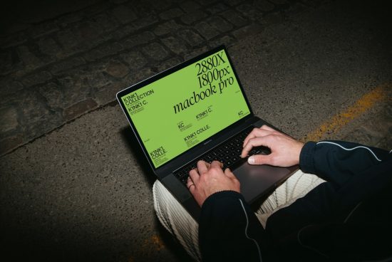 Person working on a MacBook with a green screen mockup, ideal for designers' digital presentations and templates.