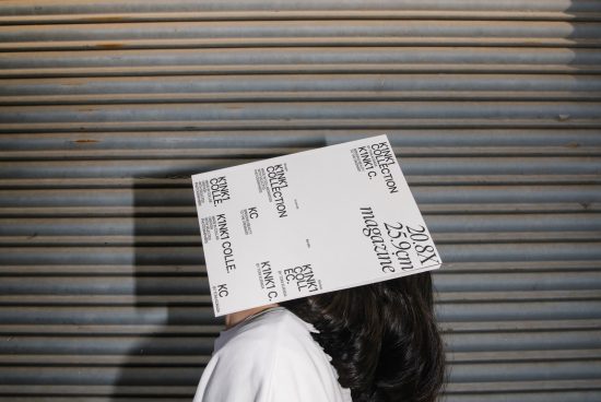 Person with white paper mockup on head against corrugated metal, showcasing modern text and font design, suitable for graphic templates.
