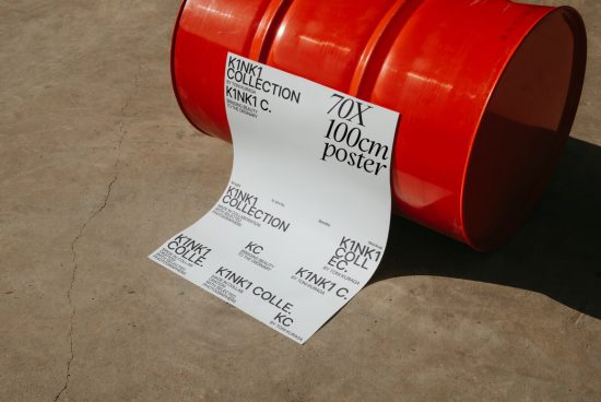 Creative poster mockup design featuring a white poster with black text leaning on a red barrel, on a concrete floor, for graphic and print designers.