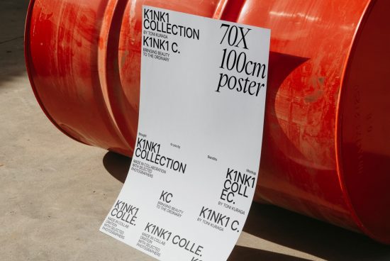 Poster mockup leaning against a red barrel in sunlight, depicting design text for KINK1 COLLECTION. Ideal for showcasing graphic design work.