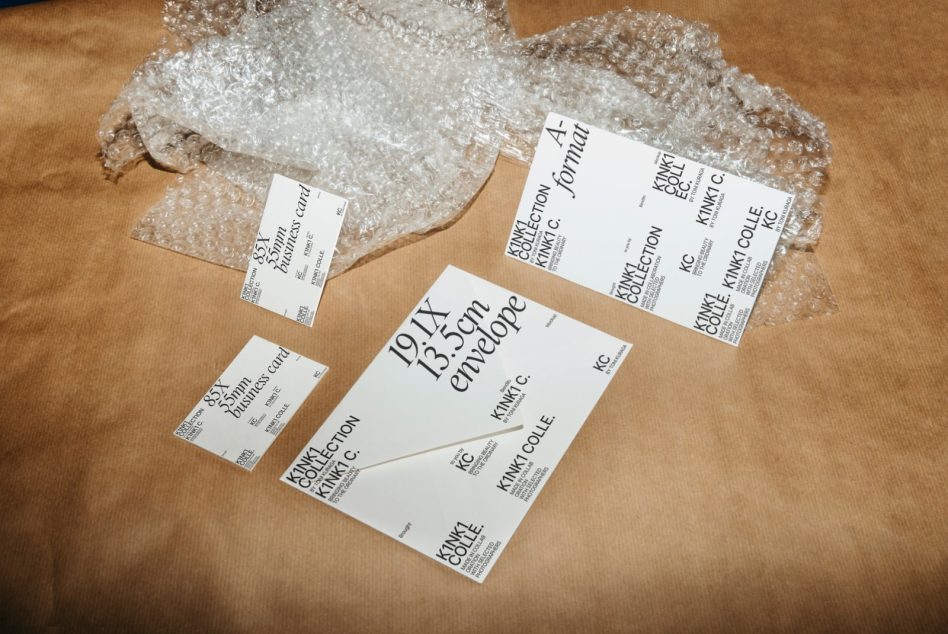 Business cards with serif typeface scattered on kraft paper with bubble wrap texture