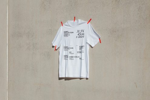 White T-shirt mockup pinned to wall with shadows for logo and text design presentations, ideal for fashion designers and retail branding.