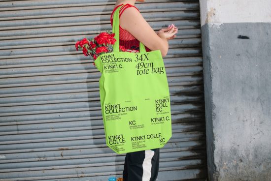 Bright green tote bag mockup with floral design on shoulder of person against metal shutter, urban style, fashion accessory, product presentation.