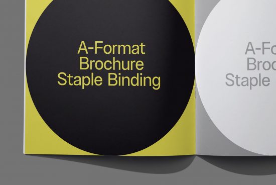 A-Format brochure mockup with yellow cover and staple binding displayed on a gray background, ideal for presenting design templates.