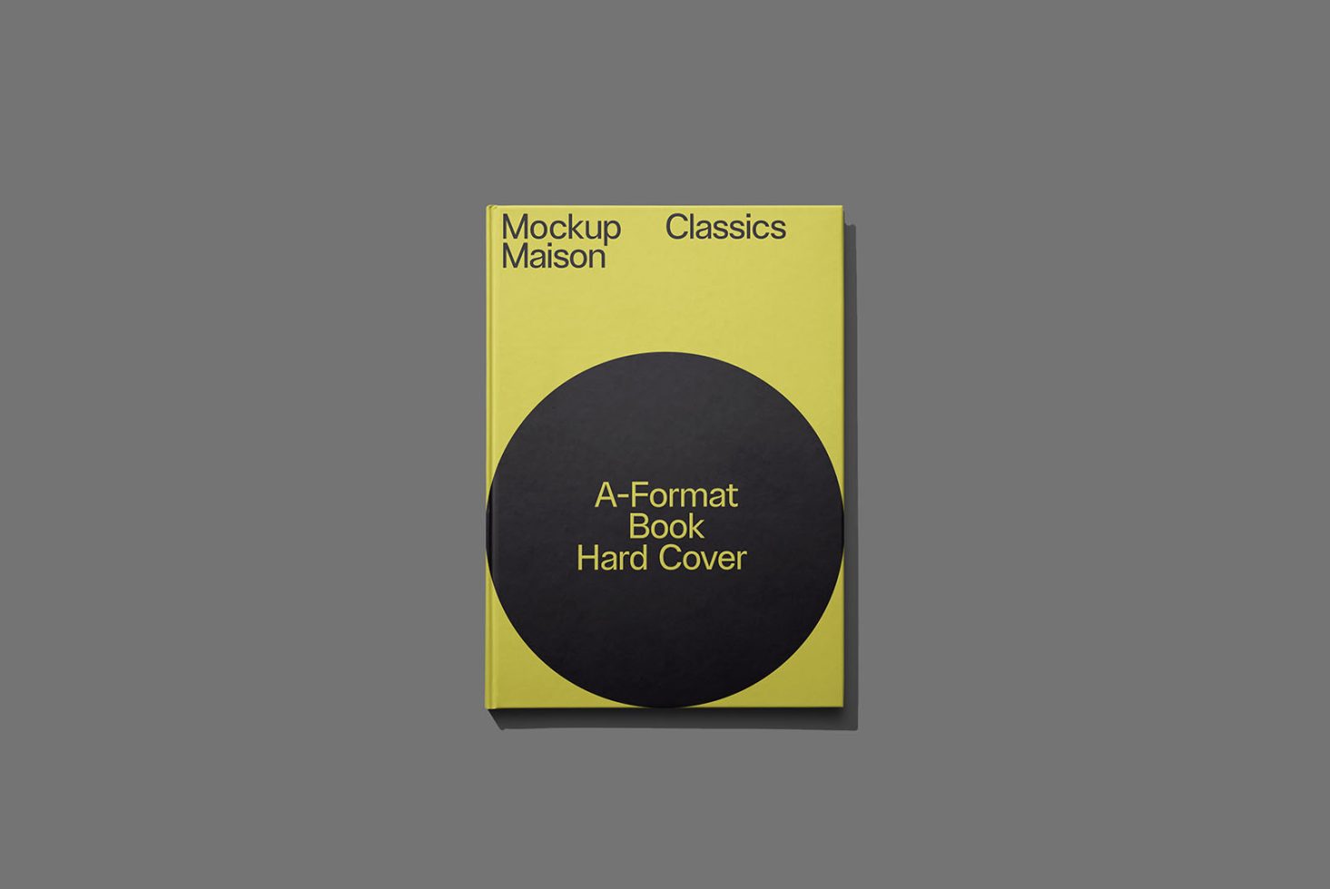 Elegant A-format hardcover book mockup in yellow and black on a grey background, perfect for designers to showcase cover designs.