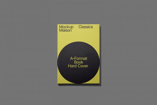 Elegant A-format hardcover book mockup in yellow and black on a grey background, perfect for designers to showcase cover designs.