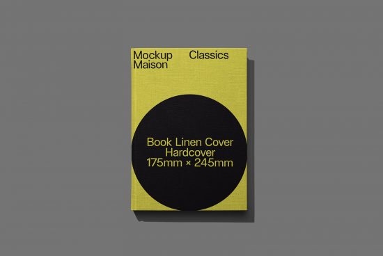 Yellow linen cover book mockup with black circle design on grey background, showcasing dimensions 175mm x 245mm, for graphic designers.