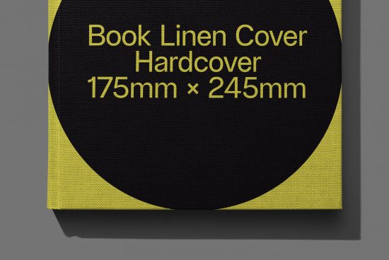 ALT: Close-up of a black linen hardcover book mockup with yellow detail, 175mm x 245mm, ideal for design presentations and portfolio.