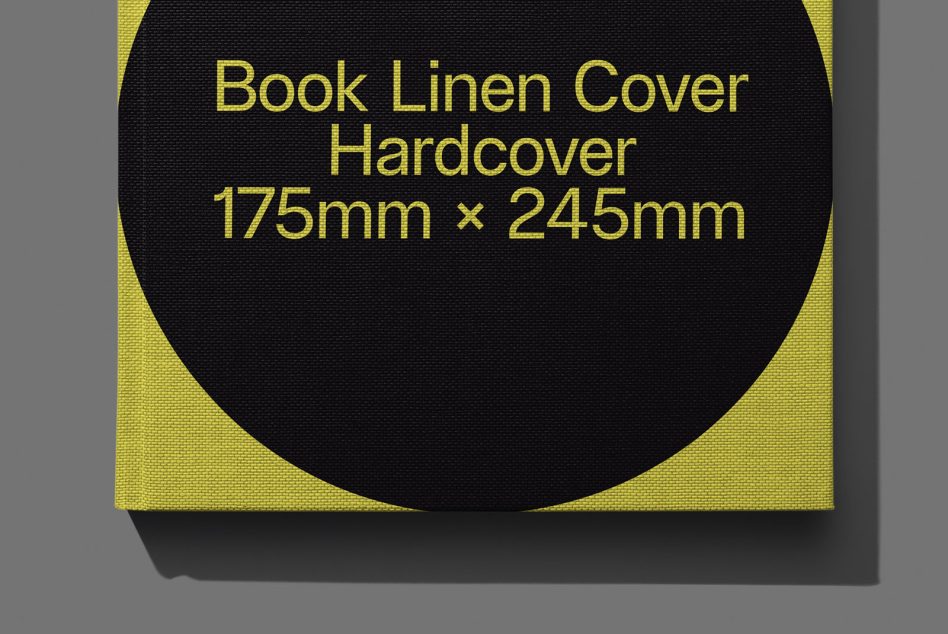 ALT: Close-up of a black linen hardcover book mockup with yellow detail, 175mm x 245mm, ideal for design presentations and portfolio.