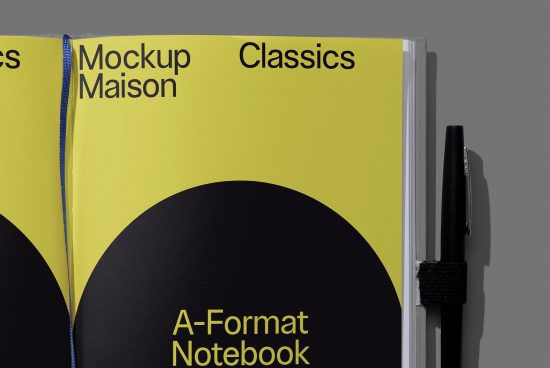 Realistic notebook mockup with yellow cover, pen holder, and elegant sans-serif typeface, ideal for presenting designs and fonts.