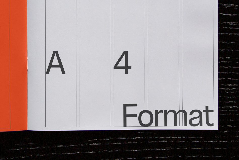 Open notebook showing A4 format pages with vertical dividing lines