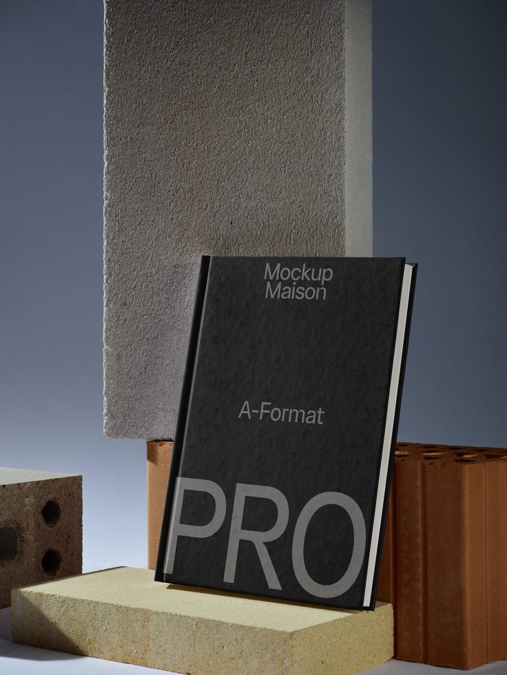 Elegant A-format book mockup standing on construction materials with stylish background for graphic design showcase.