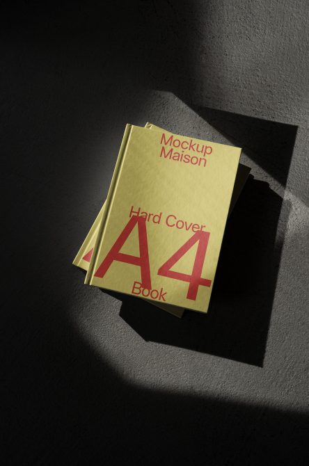 Pale yellow hardcover A4 book mockup with magenta typography