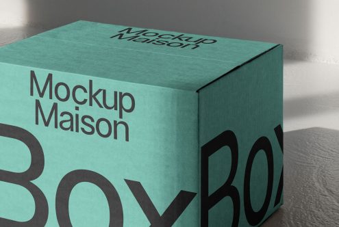 Turquoise packaging box mockup with bold font, showcasing design space, ideal for product Mockups category in a digital asset marketplace.